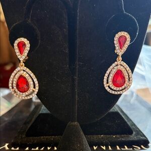 NWOT gold tone, vibrant, red and clear crystal. pear dropped earrings clips.